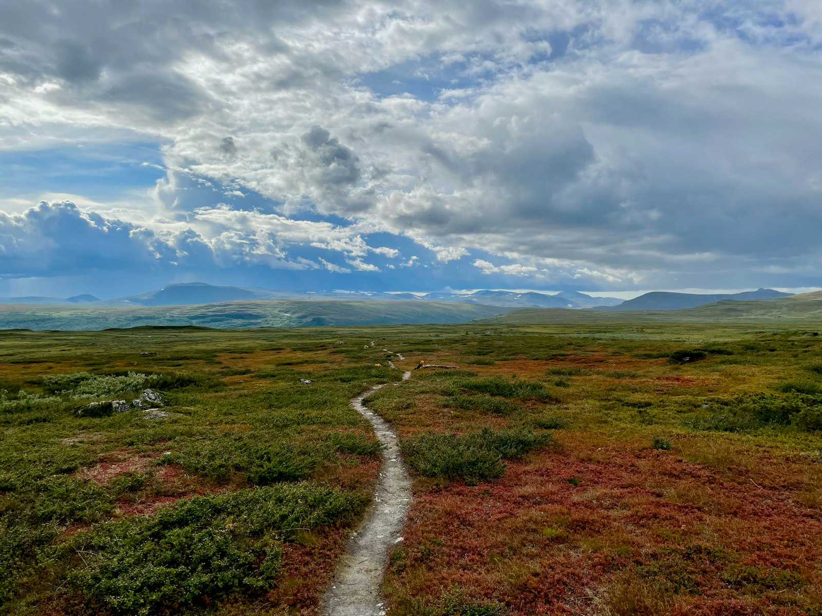 Kungsleden trail through red autumn tundra, Swedish Lapland