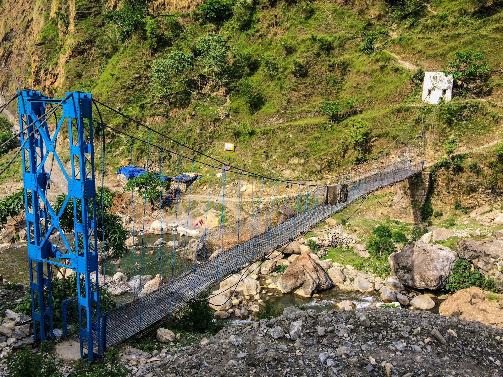 Steel suspension footbridge over a river gorge, Nepal