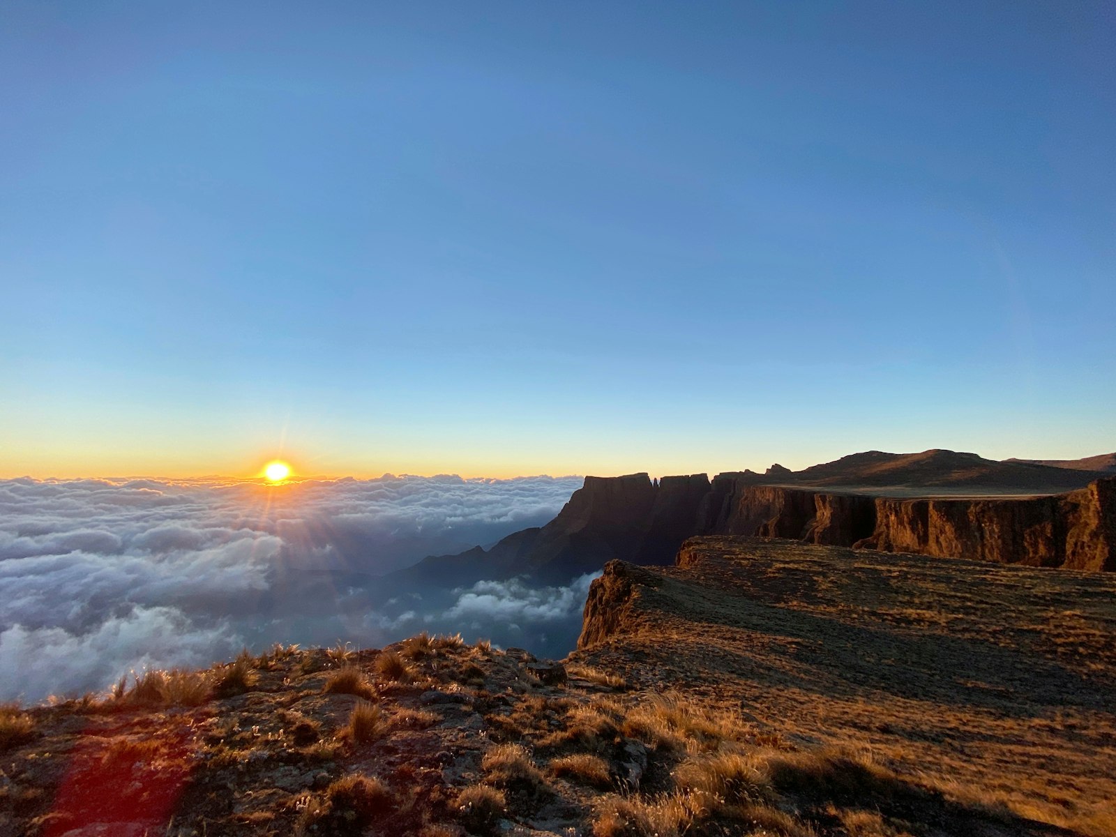 Sunrise over the Amphitheatre cliff wall, Drakensberg