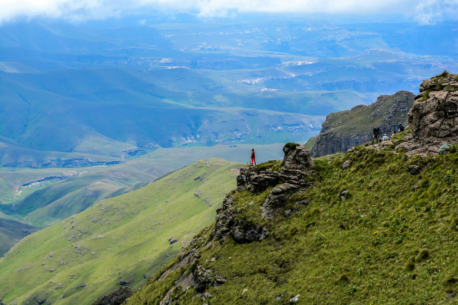 Hikers over the Amphitheatre valley, Drakensberg