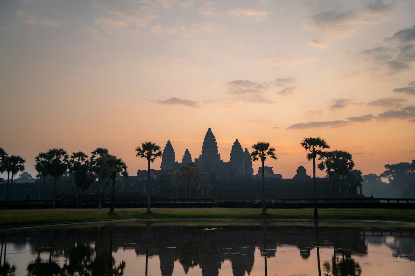 Angkor Wat's towers reflected in the moat at dawn, Cambodia