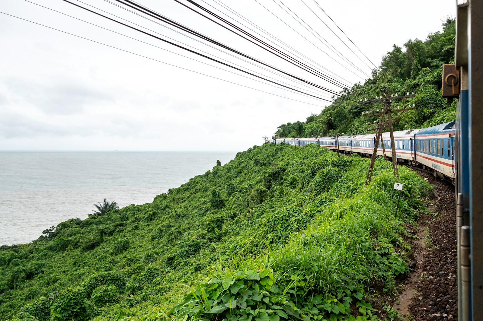 Train winding along the coast above the ocean, Vietnam
