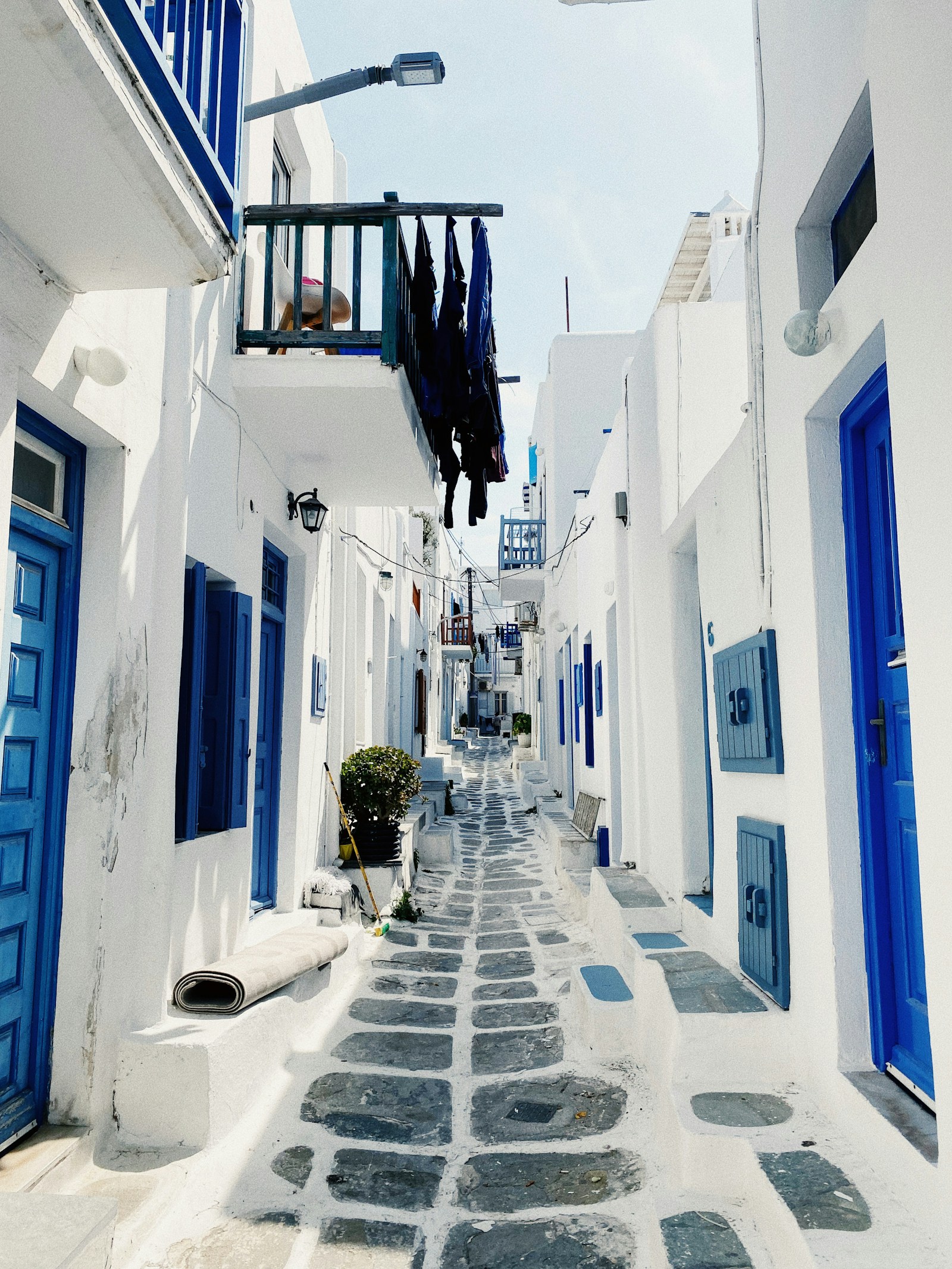 Whitewashed alley with blue doors, Cyclades