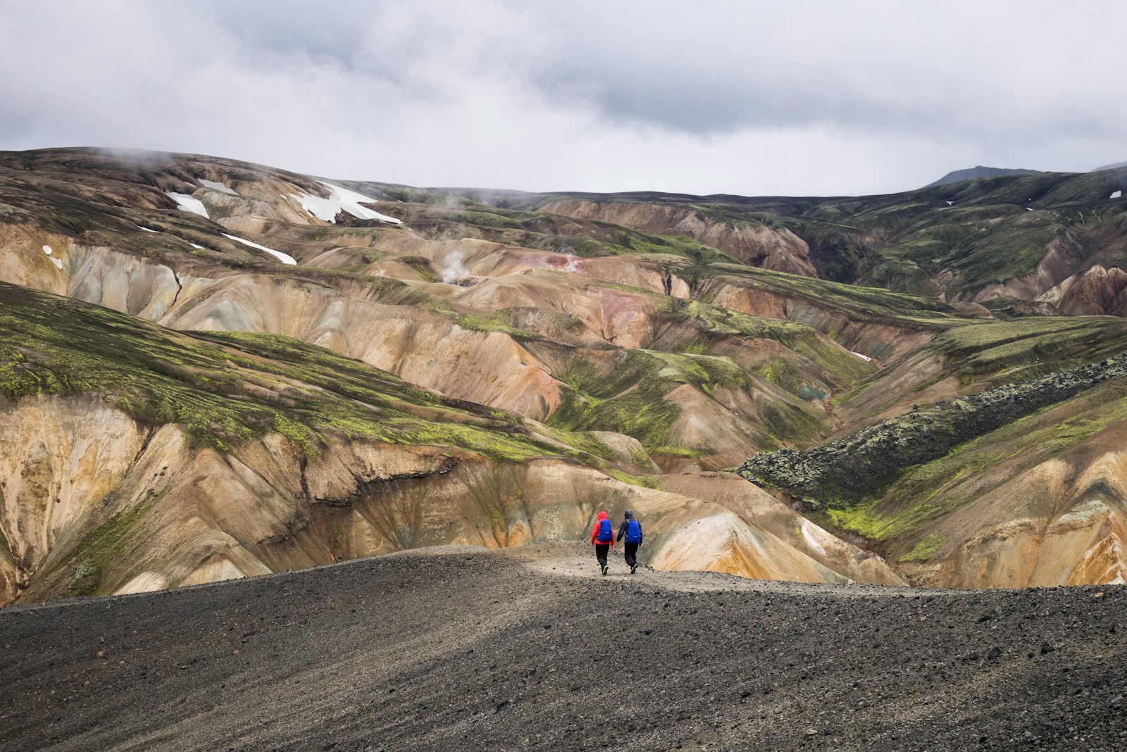 Trekkers among colourful rhyolite mountains, Laugavegur, Iceland