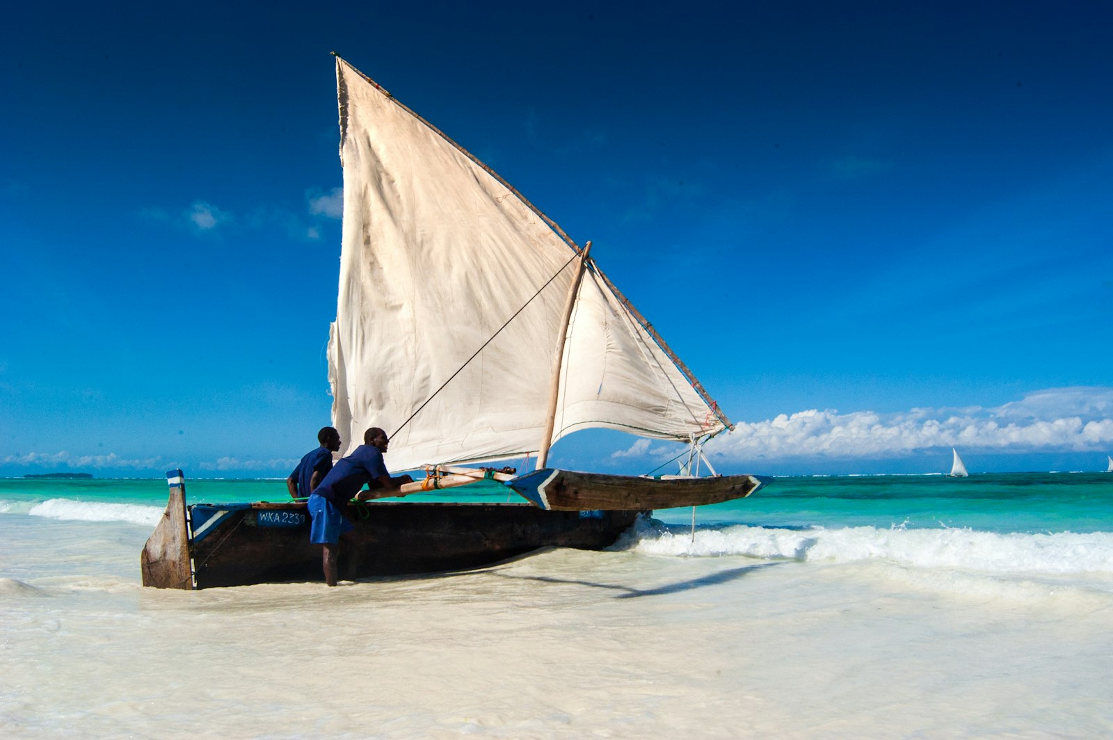 Traditional dhow in turquoise shallows, Mafia Island