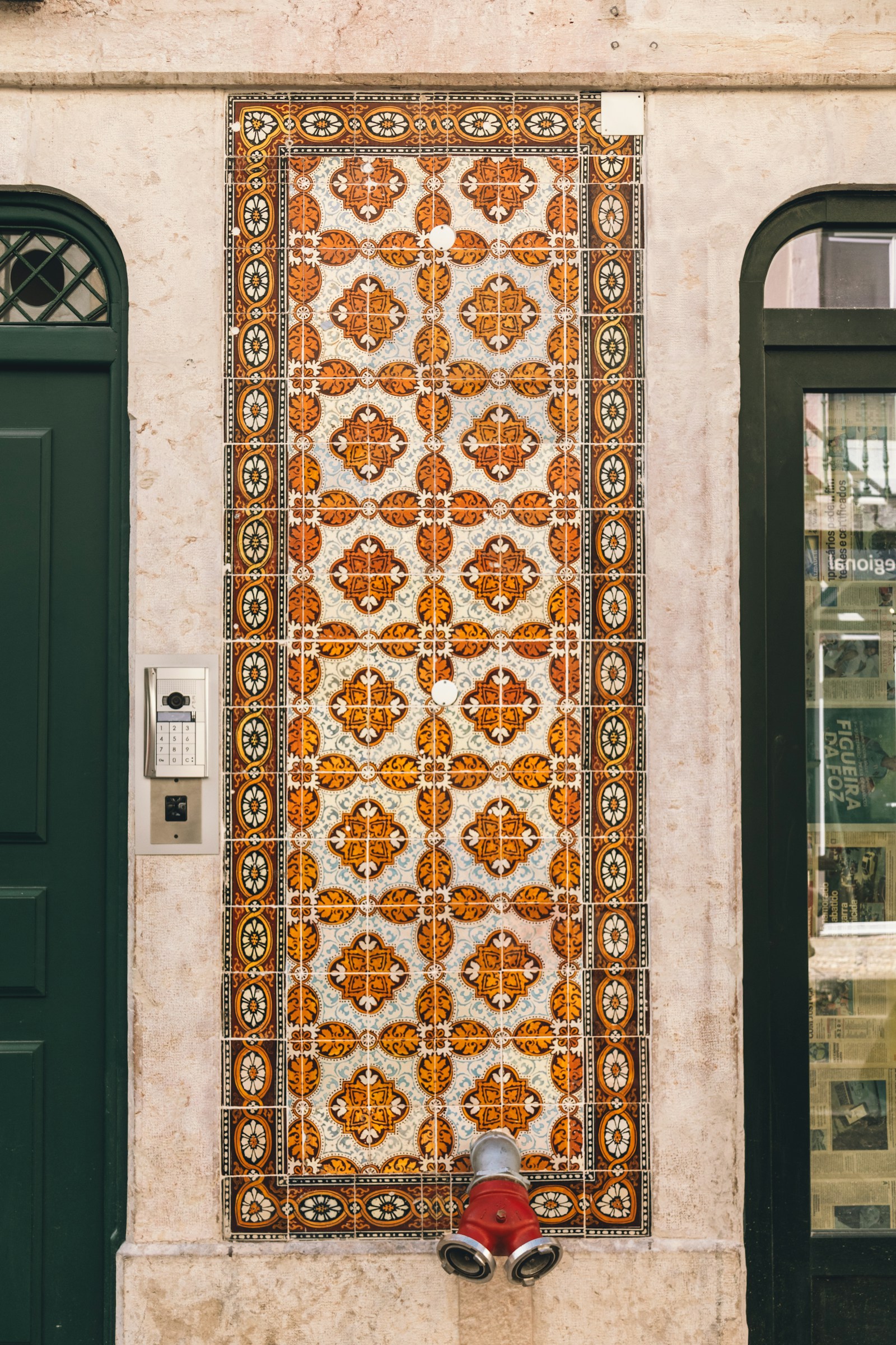 Ornate azulejo tile panel on a Lisbon doorway