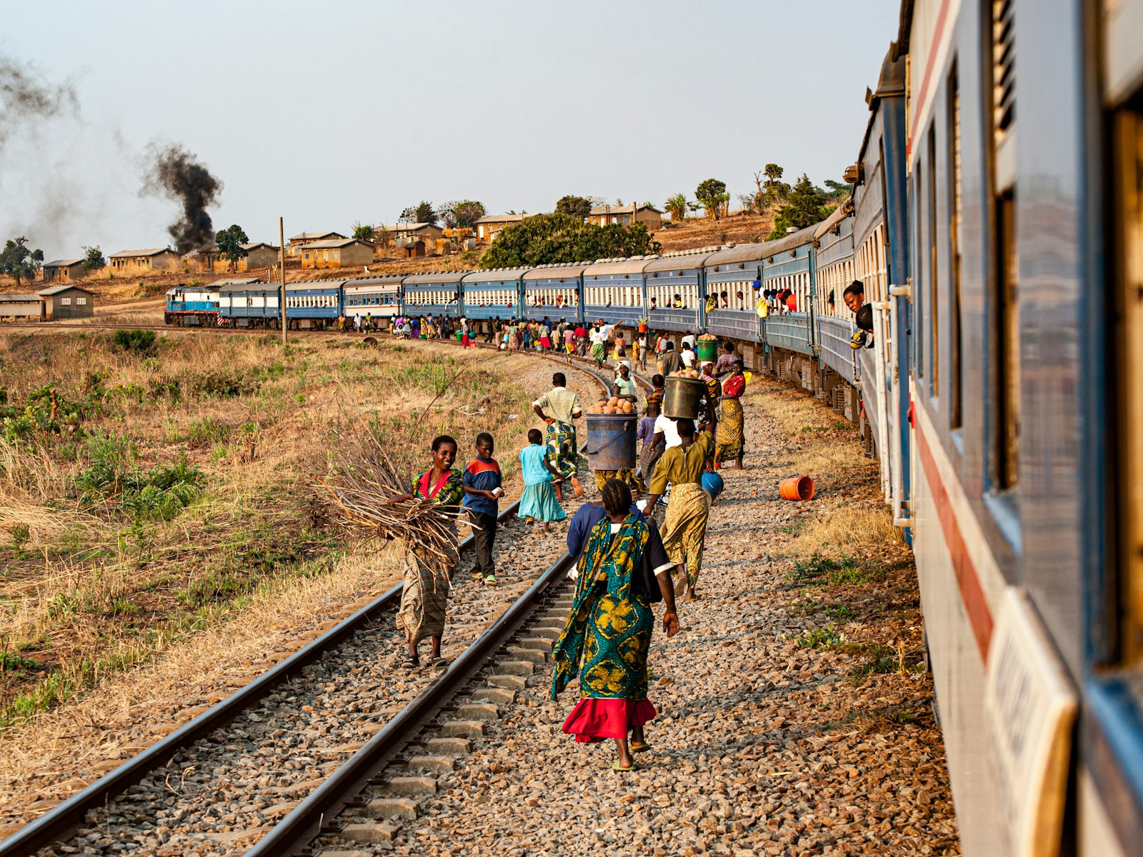 Trackside vendors at a rural station on the Tazara line
