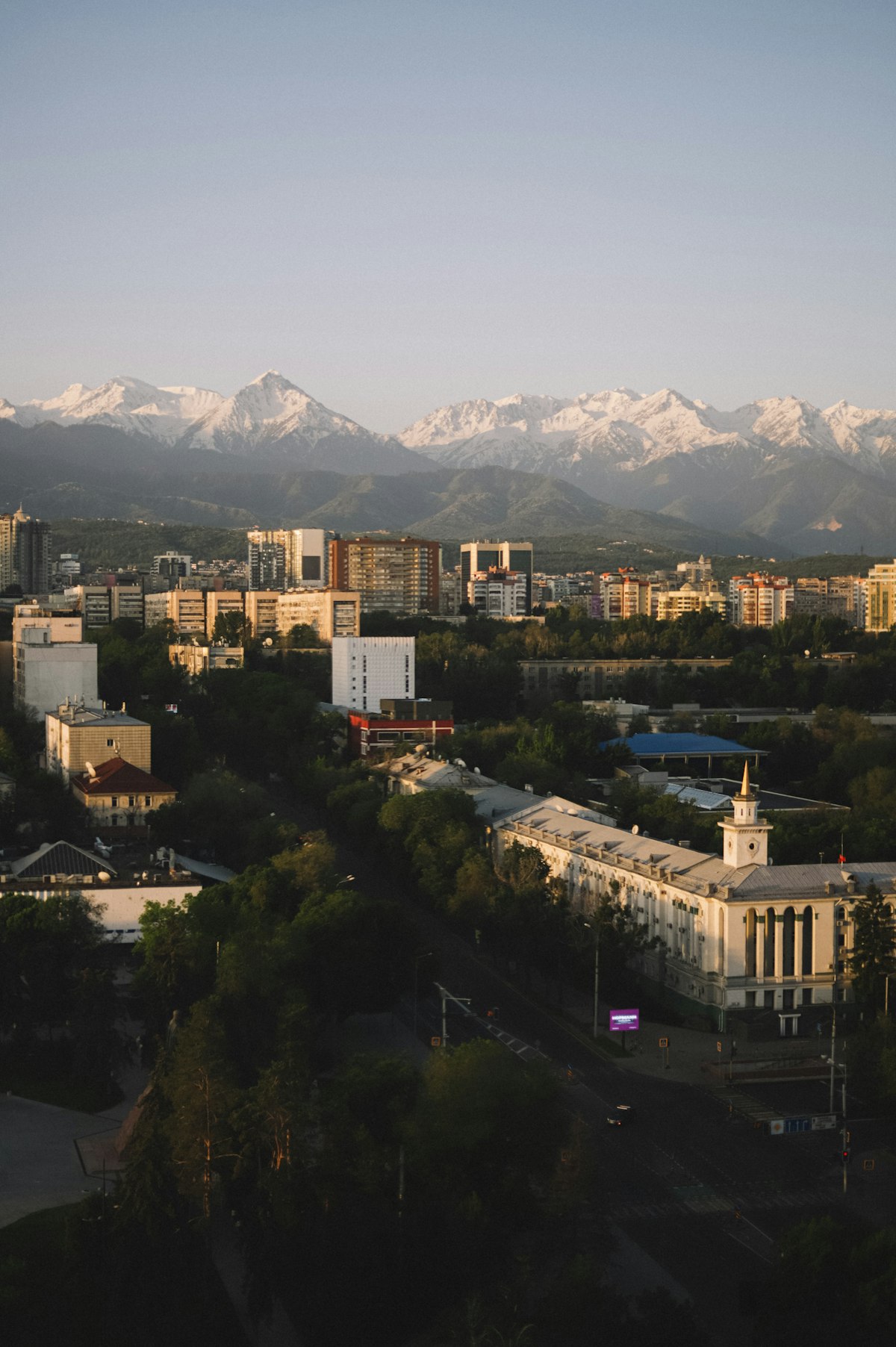 Almaty skyline at sunset with the mountains behind