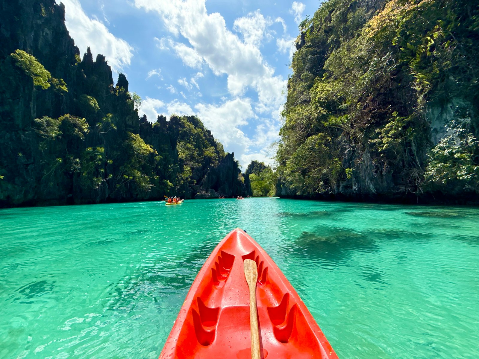 Kayaking through a narrow limestone channel into the Big Lagoon