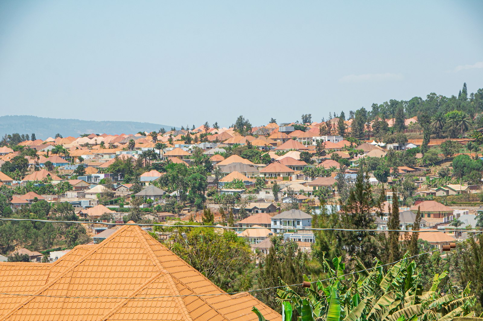 View across Kigali's terracotta rooftops and green hills